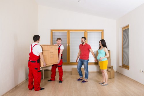 Professional movers loading a truck in Chiswick